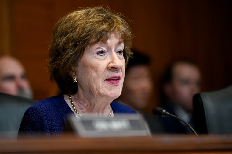 Susan Collins speaks while seated during a hearing