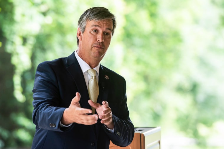 Barry Moore speaks while standing outside