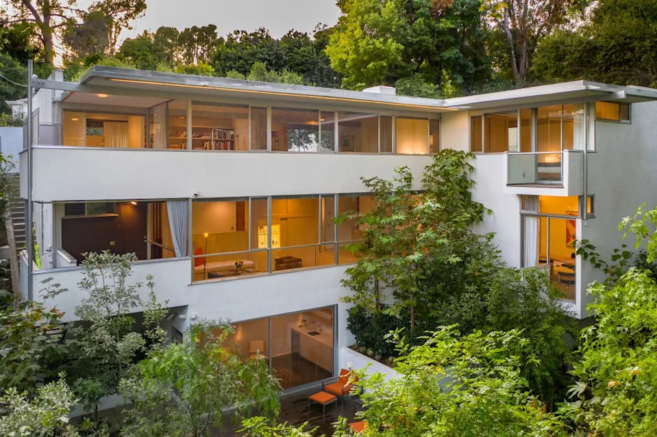 The structure stands in breathtaking harmony with the verdant surroundings. Cameron Carothers