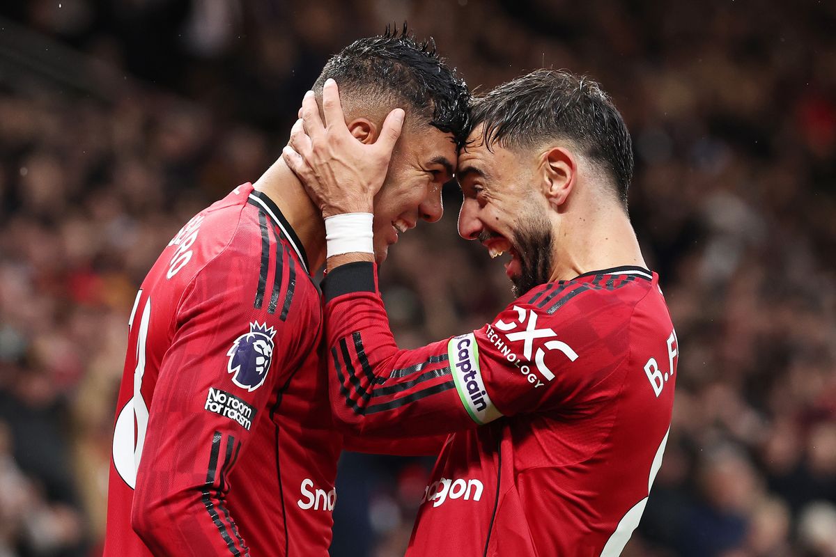 Casemiro of Manchester United celebrates scoring his team's second goal with teammate Bruno Fernandes during the Premier League match between United and Chelsea 
