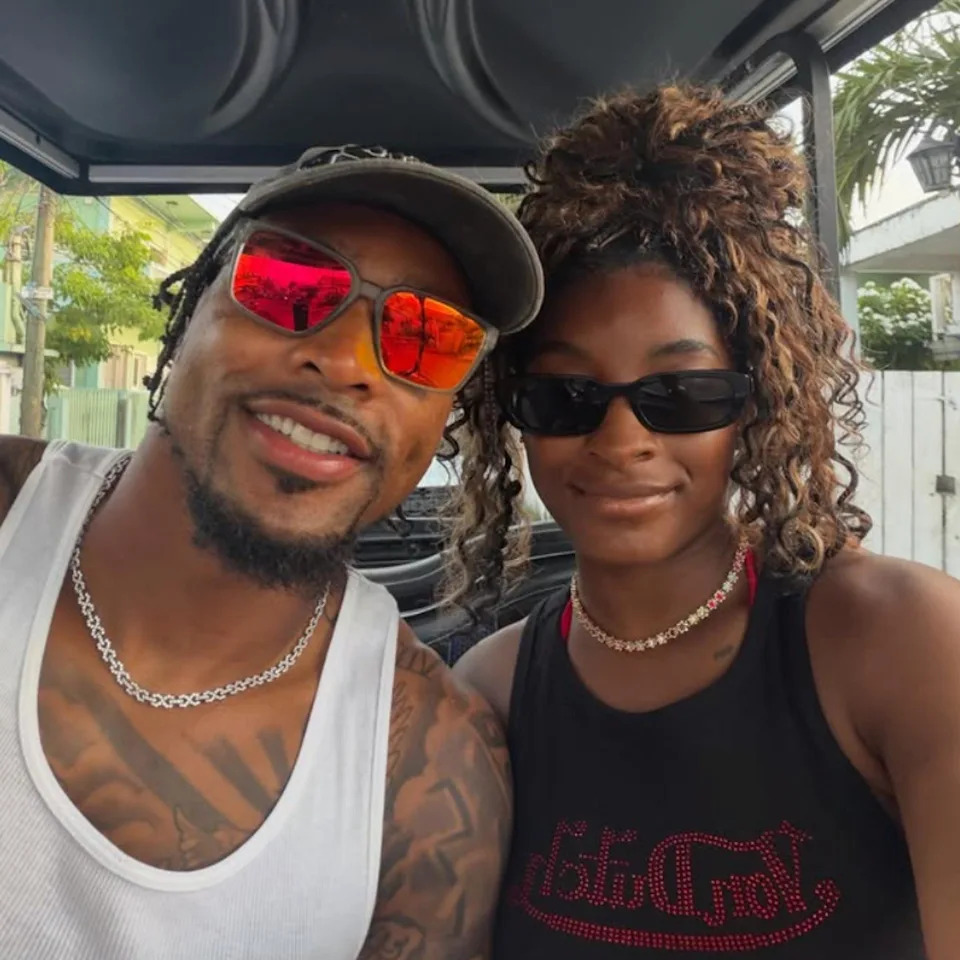 Simone Biles and her husband Jonathan Owens pose for a photo on vacation in Belize