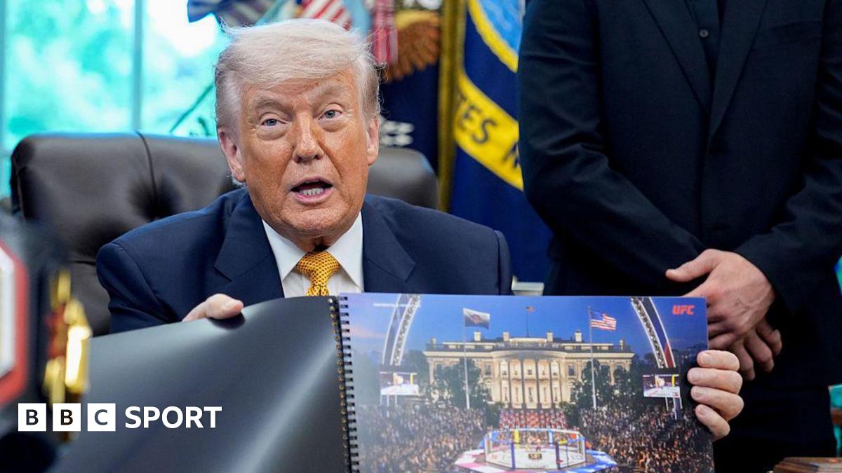 Donald Trump hols up a rendered image of the UFC's White House event
