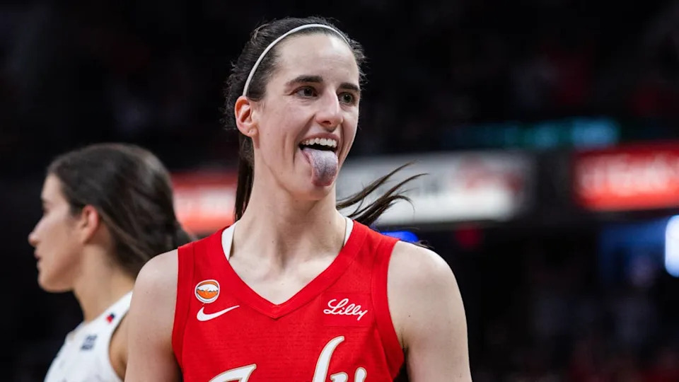 Indiana Fever guard Caitlin Clark reacts during a WNBA game.Trevor Ruszkowski-Imagn Images