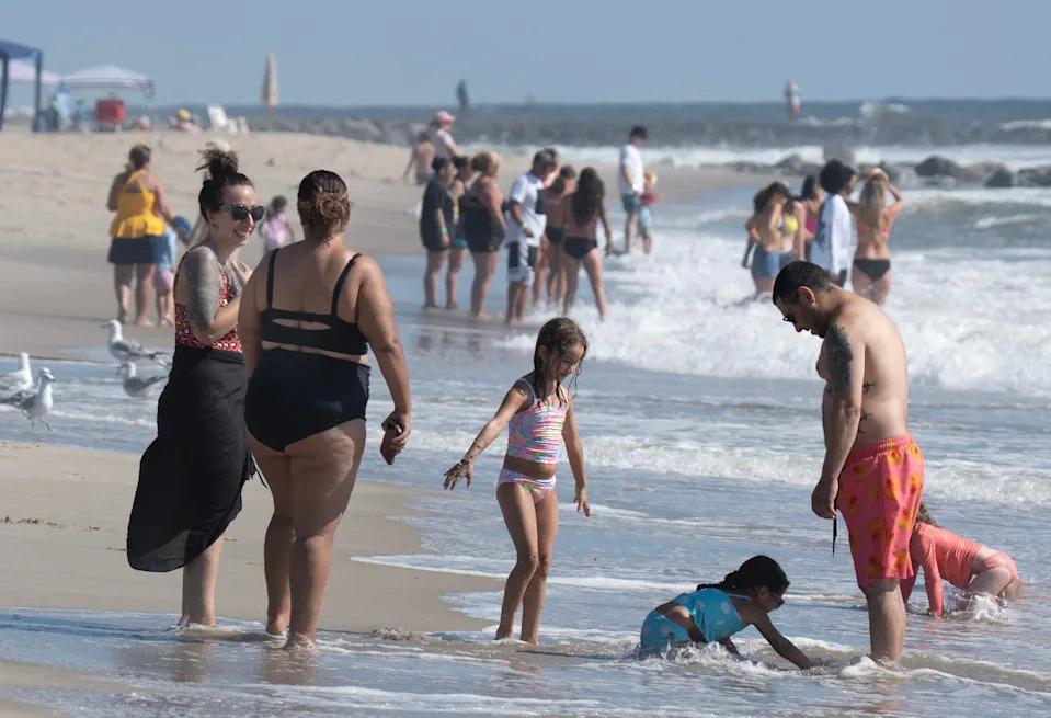 Children play in the water at the Asbury Park beach. Our Shore Towns: Asbury Park: From sunrise till past sunset.