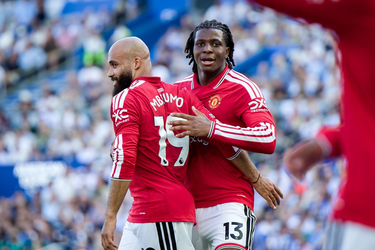 Patrick Dorgu celebrates with Bryan Mbeumo