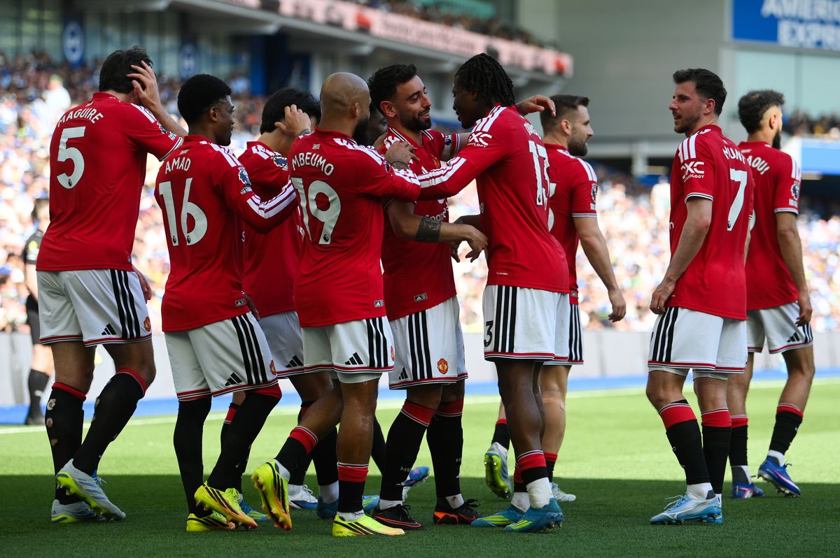 Patrick Dorgu of Manchester United celebrates scoring his team's first goal with captain Bruno Fernandes during the Premier League match between Brighton & Hove Albion and Manchester United