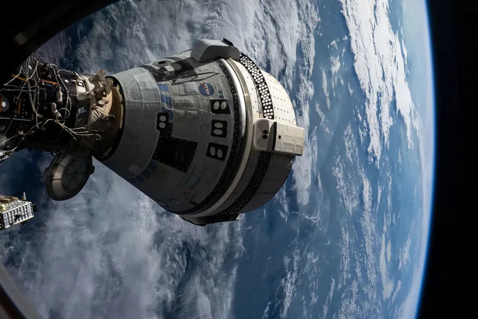 Boeing’s Starliner spacecraft that launched NASA astronauts Butch Wilmore and Suni Williams to the International Space Station is pictured July 3, 2024 docked to the Harmony module’s forward port. This view is from a window on the SpaceX Dragon Endeavour spacecraft docked to the port adjacent to the Starliner.