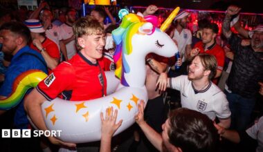 England fans in celebratory mood in a packed bar in Boston ahead of Tuesday's game against Ghana