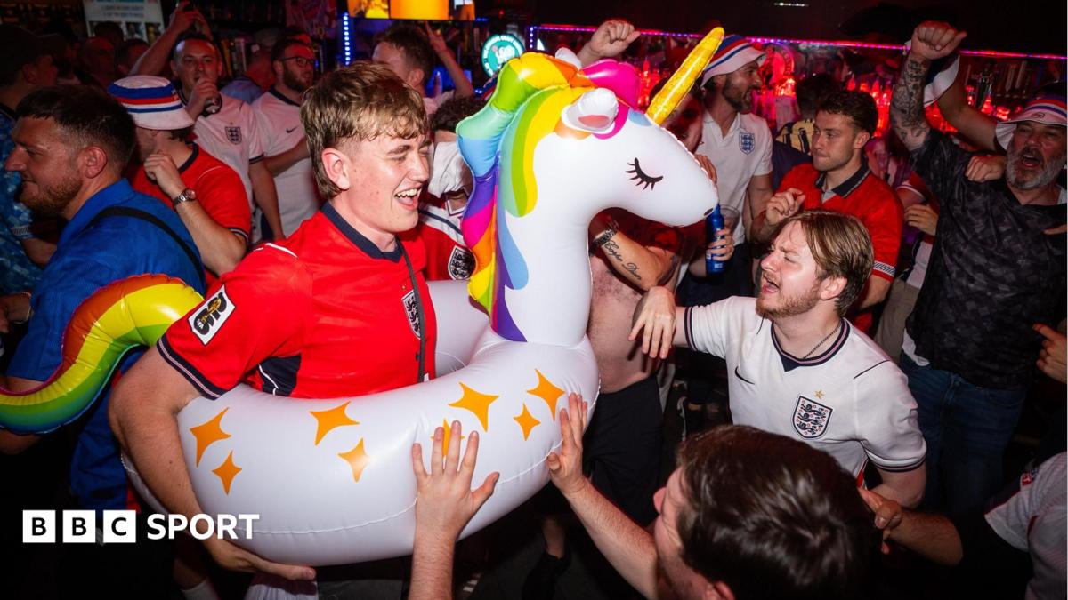 England fans in celebratory mood in a packed bar in Boston ahead of Tuesday's game against Ghana