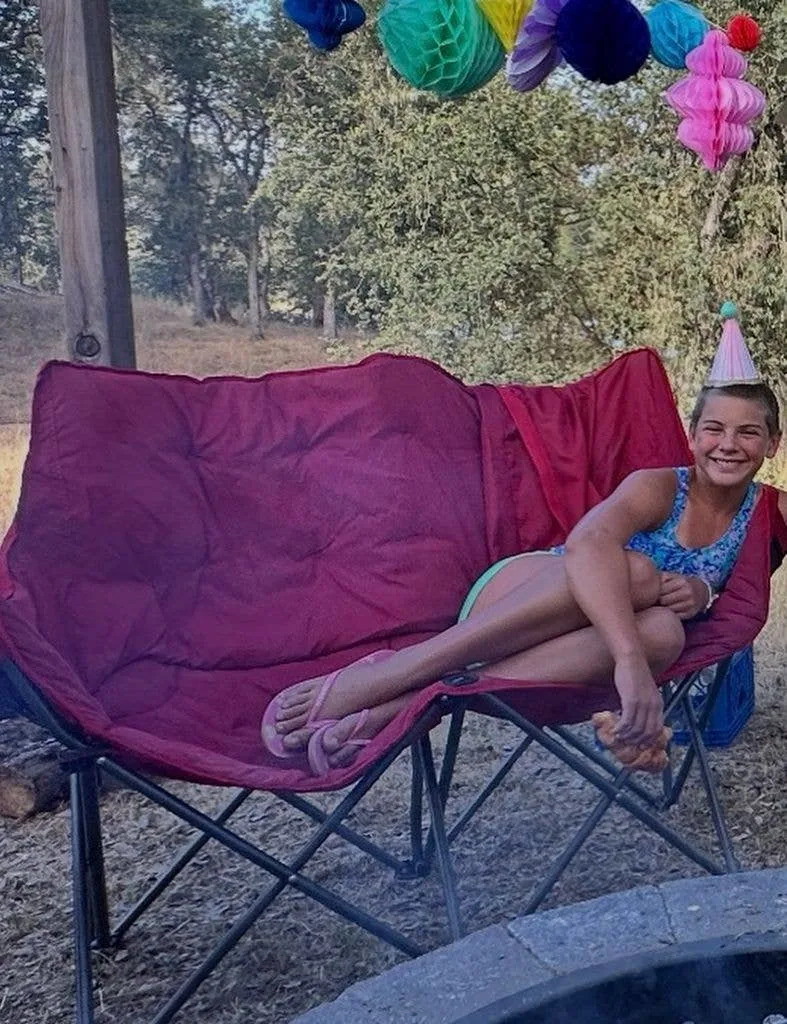 Pink and Carey Hart's daughter, Willow Sage Hart, lays on a fold-out picnic chair, shared on Instagram