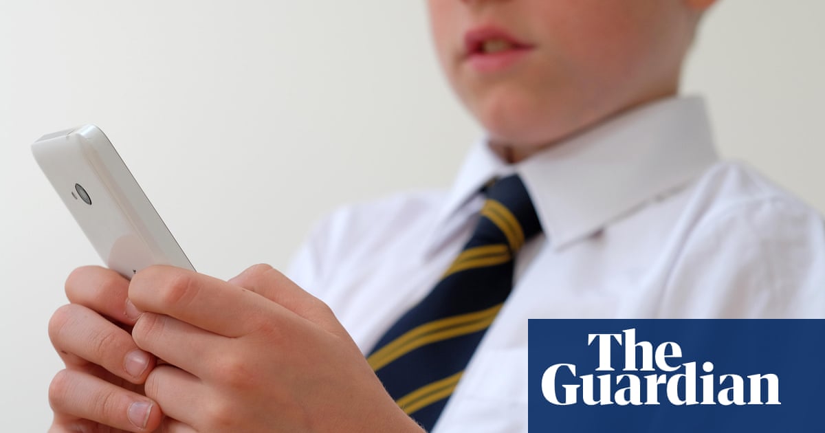 School smartphone bans seen as ‘punitive’ by young people, study says | Education policy
