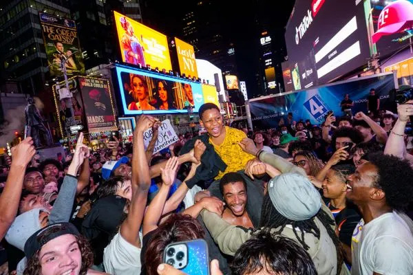 New York Knicks fans celebrate in Times Square as they win Game 4 of the NBA Finals between New York Knicks and San Antonio Spurs, on June 10, 2026 in New York City.
