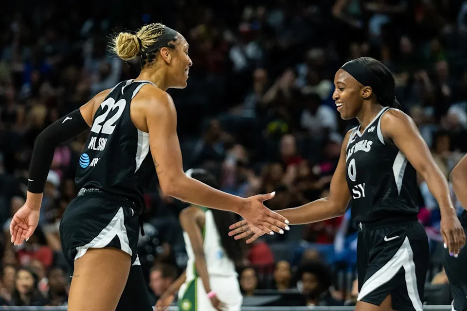 Las Vegas Aces forward A’ja Wilson (22) and guard Jackie Young (0) high-five one another during a WNBA game between the Las Vegas Aces and the Seattle Storm, Monday June 8, 2026 in Las Vegas, Nev.
