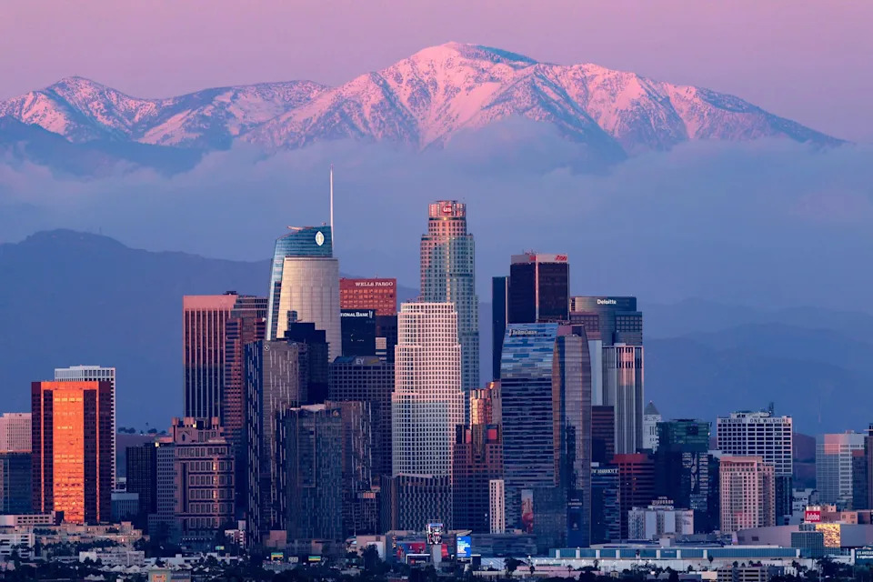 The Los Angeles skyline rises beyond one of the nation's most seismically active regions. Scientists say understanding the behavior of fault systems near Cajon Pass is critical because the area serves millions of residents and supports major transportation, energy and commerce corridors across Southern California.