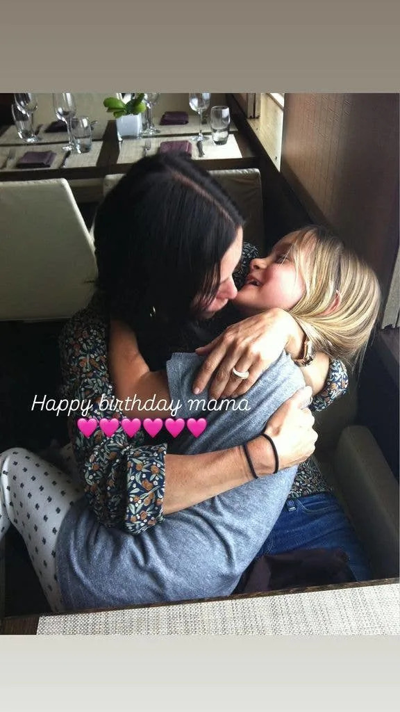 Courteney Cox and her daughter Coco hugging, shared via Instagram