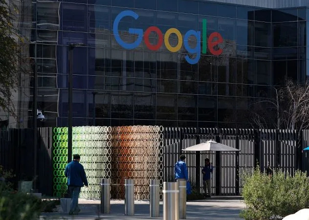 The Google logo is displayed on a building at Google headquarters on February 04, 2026 in Mountain View, California.