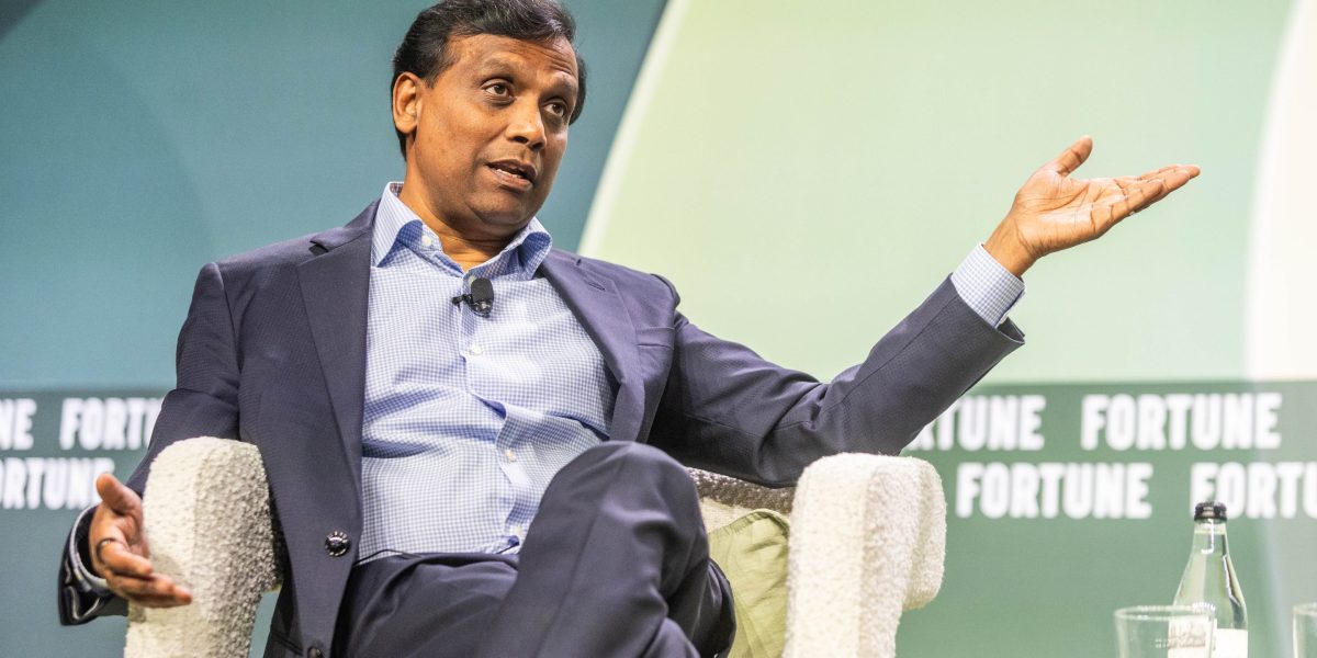 Cognizant CEO is swimming against the tide on AI: he's hiring over 20,000 graduates this year and says AI tokenmaxxing is a 'vanity metric'