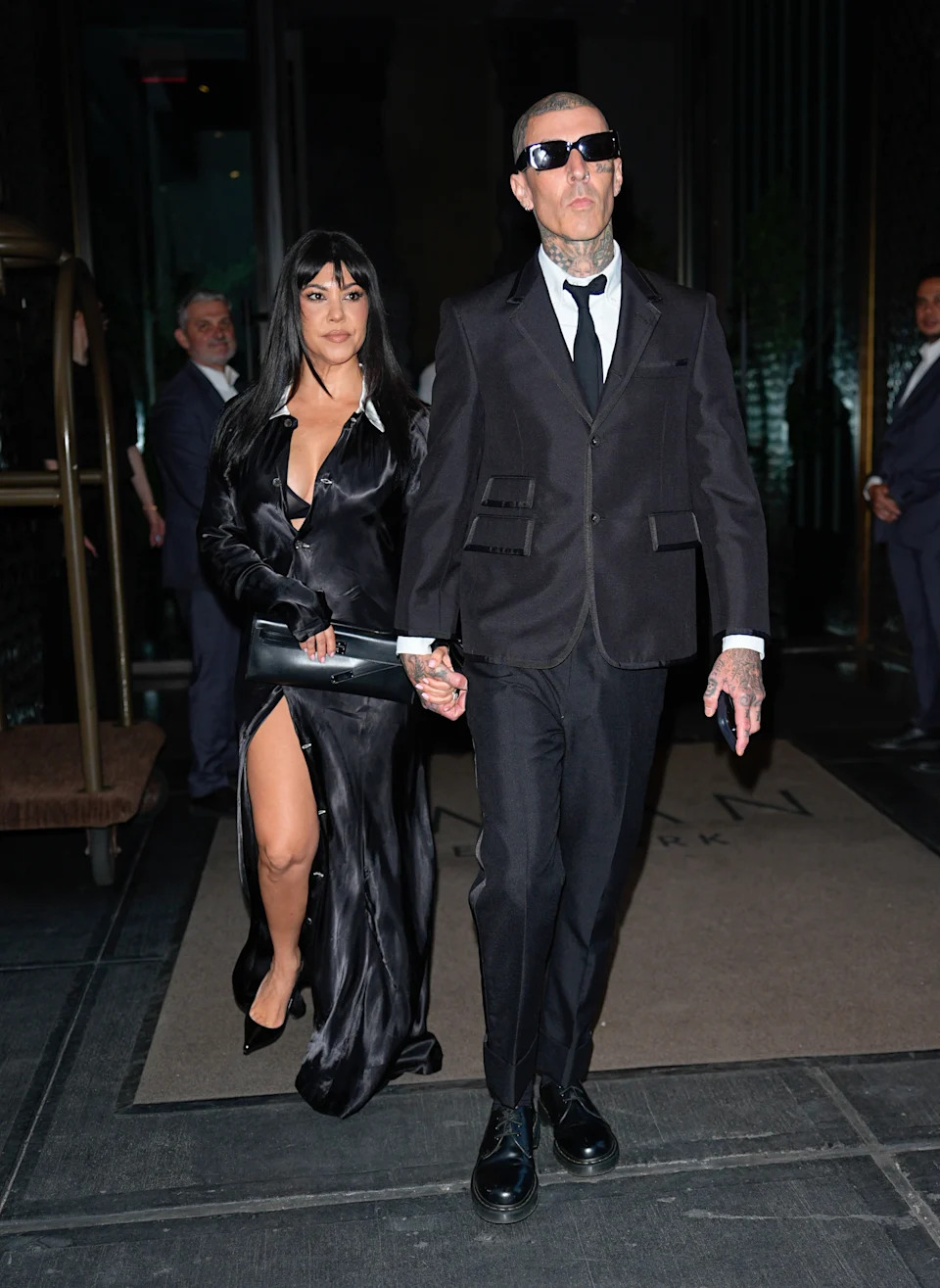 Kardashian donned a long-sleeve satin dress. ZUMAPRESS.com