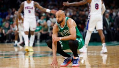The Philadelphia 76ers high-five as Boston Celtics guard Derrick White (9) looks on late in the fourth quarter. The Boston Celtics hosted the Philadelphia 76’ers in Game 7 of the first round of the NBA Playoffs on Saturday, May 2, 2026 at TD Garden in Boston, MA.