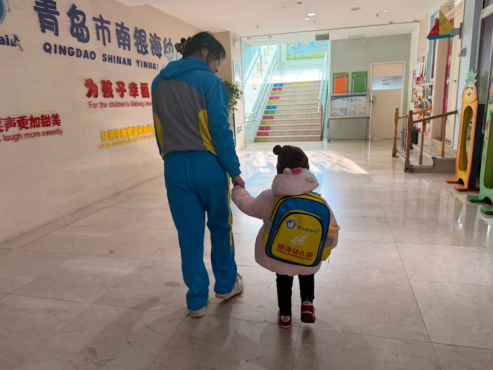 A girl walking through school in China.