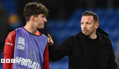 Lewis Koumas with Wales boss Craig Bellamy