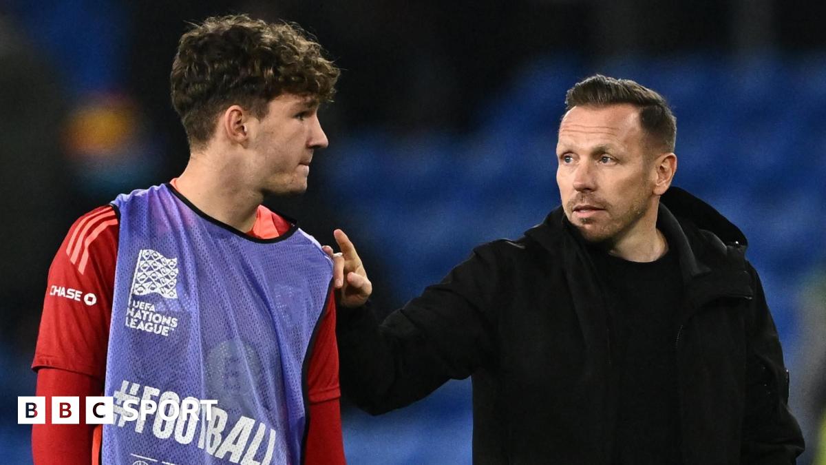 Lewis Koumas with Wales boss Craig Bellamy