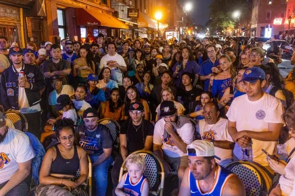 New Yorkers watch the Knicks play the San Antonio Spurs in Game Two of the NBA championship on June 5, 2026 in the Carroll Gardens neighborhood of Brooklyn.