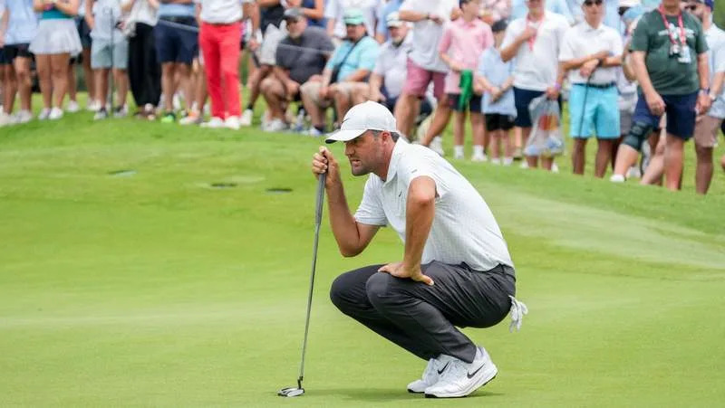 May 23, 2026; McKinney, Texas, USA; Scottie Scheffler lines up a putt on the fourth green during the third round of THE CJ CUP Byron Nelson golf tournament. Mandatory Credit: Raymond Carlin III-Imagn Images