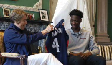 No. 1 NBA 2026 draft pick AJ Dybantsa gifts Gov. Maura Healey a signed Washington Wizards jersey in her State House office on June 29, 2026. (Ella Adams / SHNS)