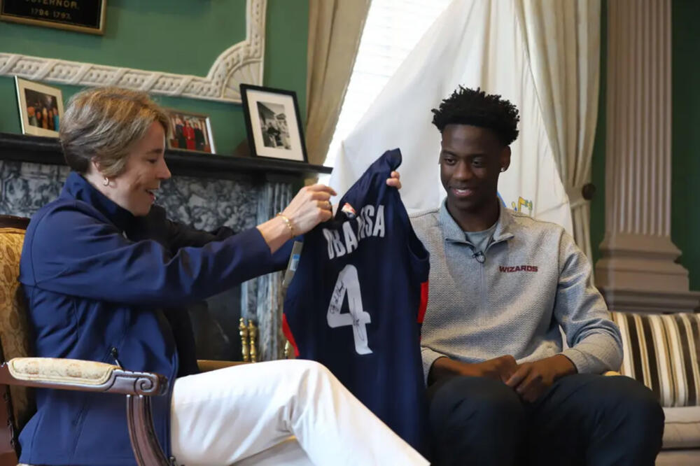 No. 1 NBA 2026 draft pick AJ Dybantsa gifts Gov. Maura Healey a signed Washington Wizards jersey in her State House office on June 29, 2026. (Ella Adams / SHNS)