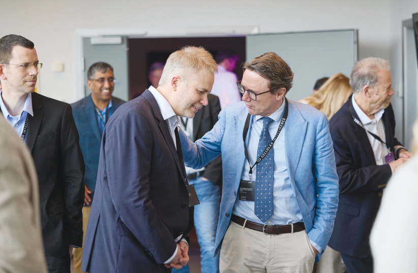 Breakstone (R) with jens Nielsen, CEO of Copenhagen’s BioInnovation Institute, during a break in the symposium.
