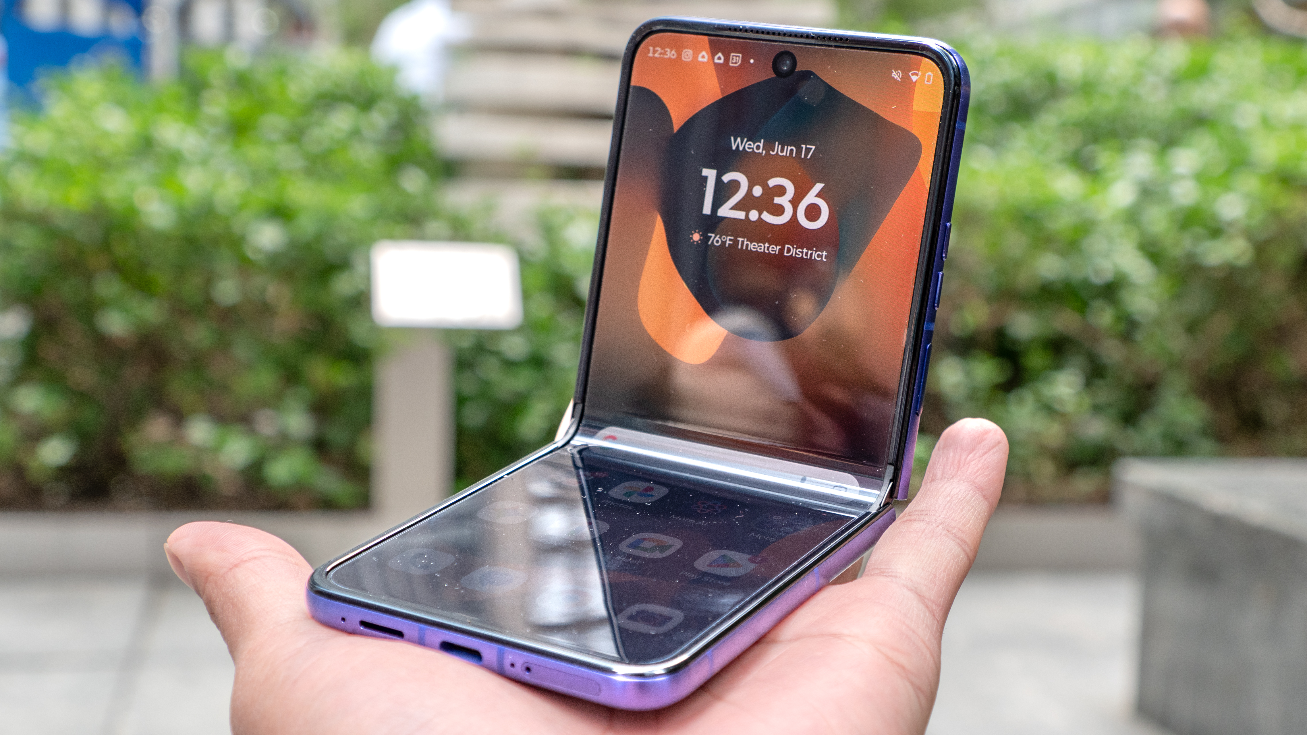 Motorola Razr Ultra 2026 folded halfway in the hand.