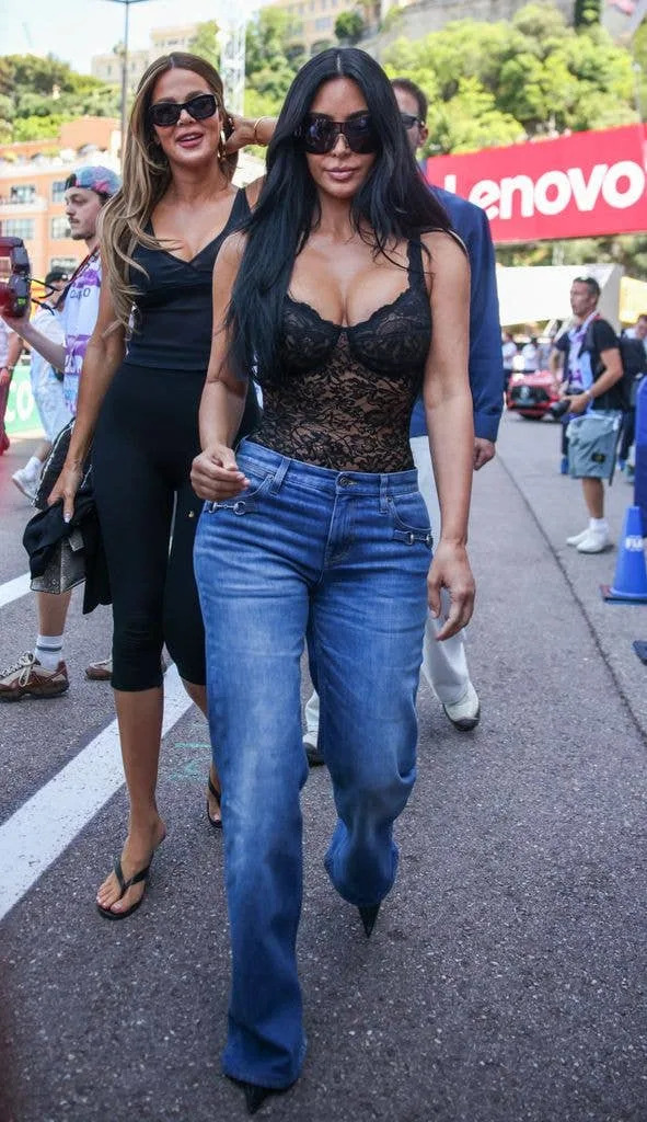 Kim and Khloe Kardashian in a pitlane at the Formula 1 Monaco Grand Prix