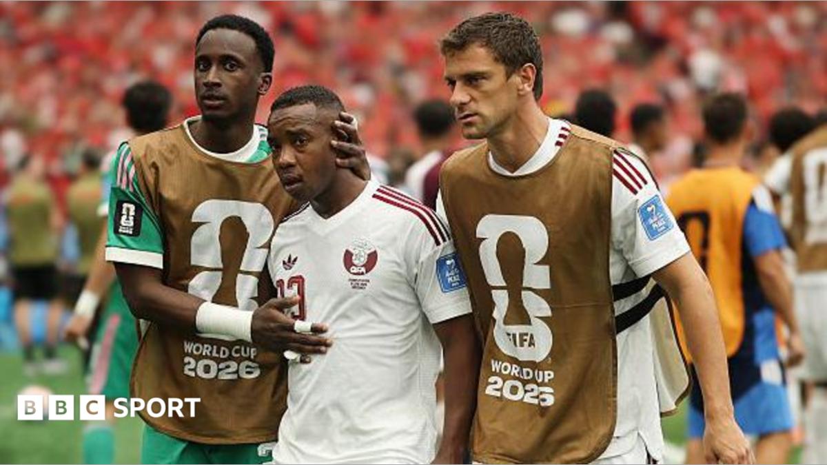 Qatar's Assim Madibo is comforted by team-mates after getting sent off in their World Cup game against Canada in 2026