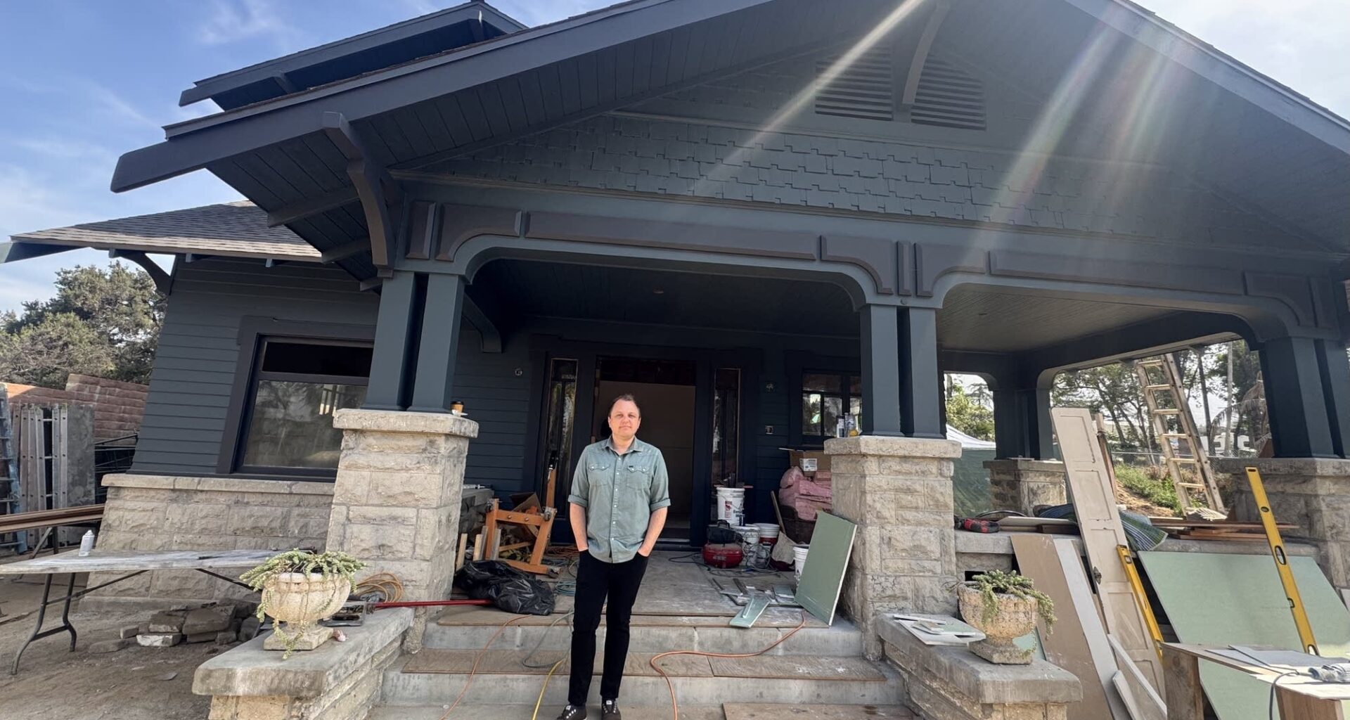 Morgan Sykes Jaybush outside the craftsman he and his team relocated from Hollywood to Altadena. He estimates it will be move-in ready this August.