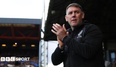 Dave Challinor applauds fans at a game
