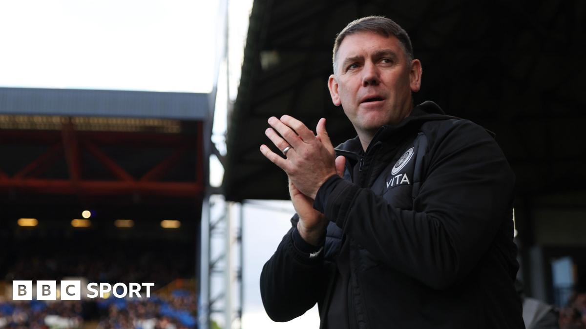 Dave Challinor applauds fans at a game