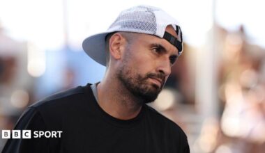 Nick Kyrgios reacts to a point while playing doubles at the Australian Open