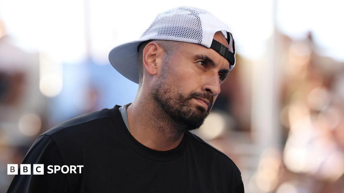 Nick Kyrgios reacts to a point while playing doubles at the Australian Open
