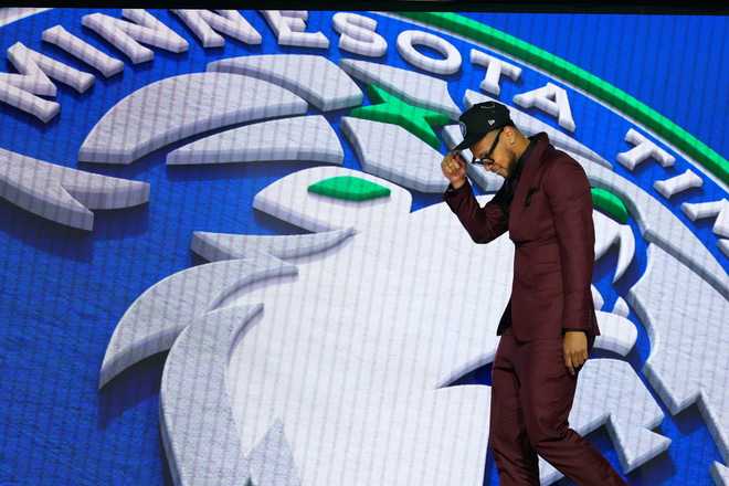 Joshua Jefferson walks off the stage after being selected by the Minnesota Timberwolves as the 28th pick in the first round of the NBA basketball draft, Tuesday, June 23, 2026, in New York. (AP Photo/Yuki Iwamura) Joshua Jefferson walks off the stage after being selected by the Minnesota Timberwolves as the 28th pick in the first round of the NBA basketball draft, Tuesday, June 23, 2026, in New York. (AP Photo/Yuki Iwamura)