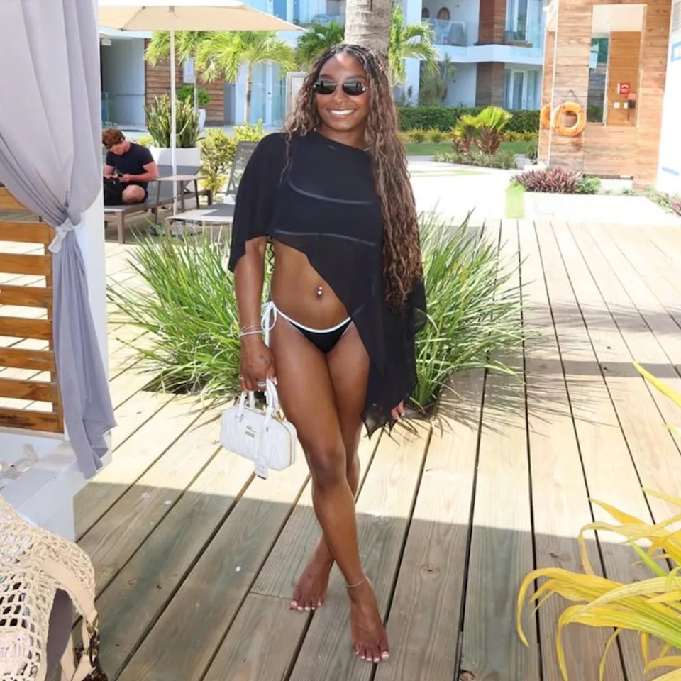 Simone Biles poses for a photo while on vacation in Belize