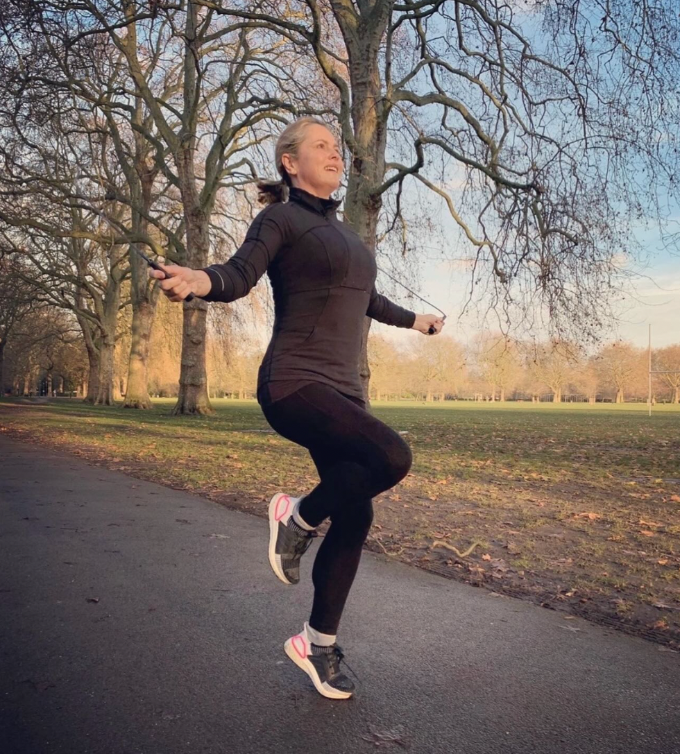 liz earle weekly workout routine: liz skipping outdoors