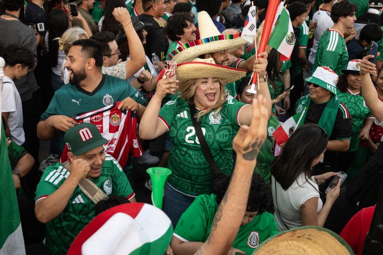 Mexico fans cheer after their team won the 2026 World Cup match between South Korea and Mexico at Seoul International Park in the Koreatown neighborhood of Los Angeles on June 18, 2026. (Photo by ETIENNE LAURENT / AFP)