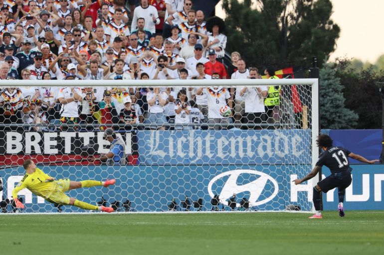 Paraguay's defender #13 Jose Canale scores a penalty kick past Germany's goalkeeper #01 Manuel Neuer to win the penalty shootout 