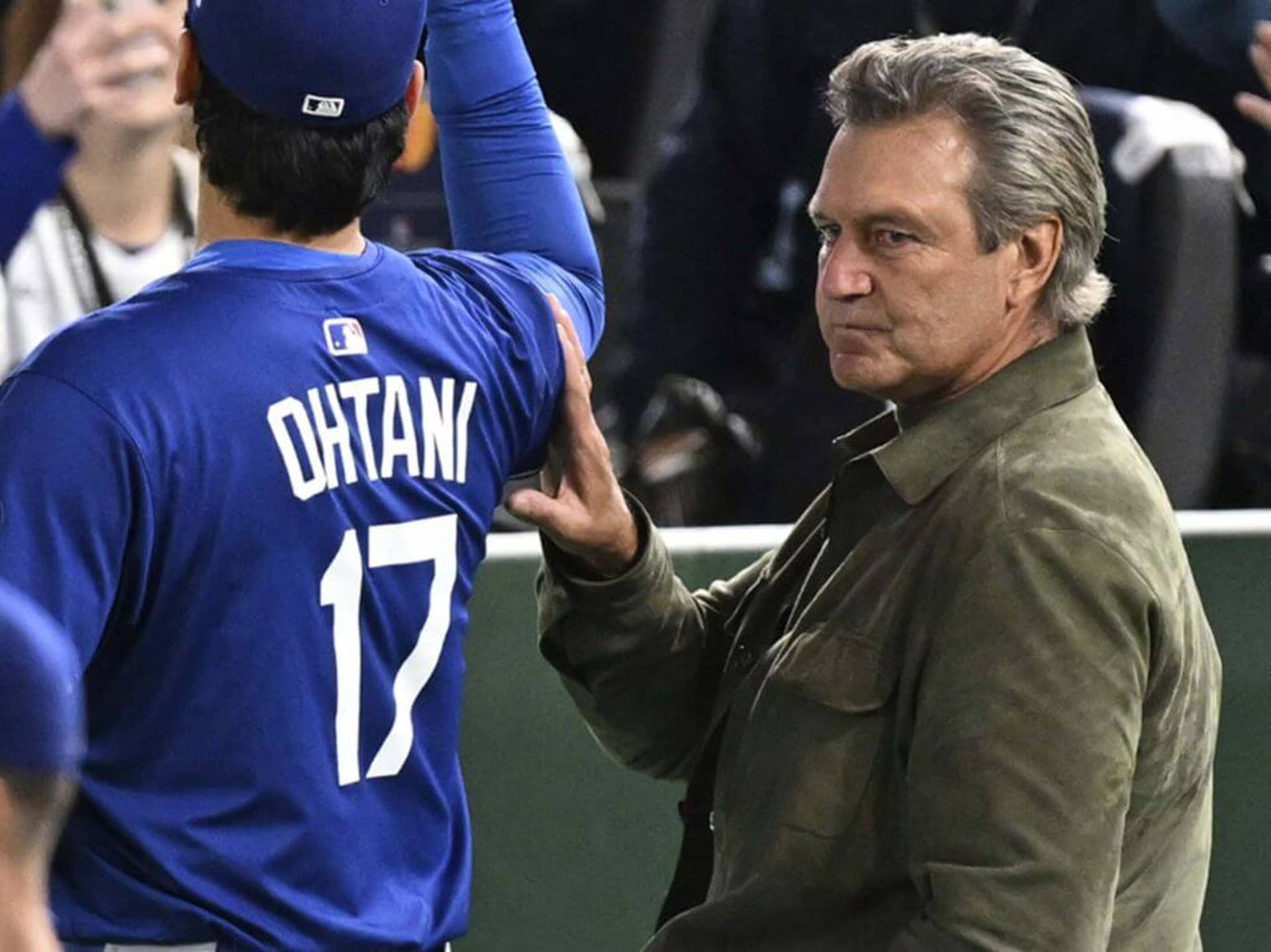 Dr. Neal ElAttrache walks alongside Shohei Ohtani before the MLB Tokyo Series game between the Dodgers and the Chicago Cubs at the Tokyo Dome on March 18, 2025.