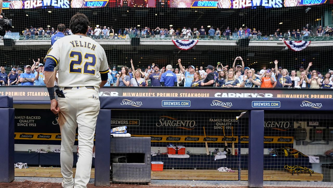 Milwaukee Brewers' Christian Yelich walks off the field after being interviewed following a win over the St. Louis Cardinals in a baseball game Monday, May 25, 2026, in Milwaukee. (AP Photo/Kayla Wolf)