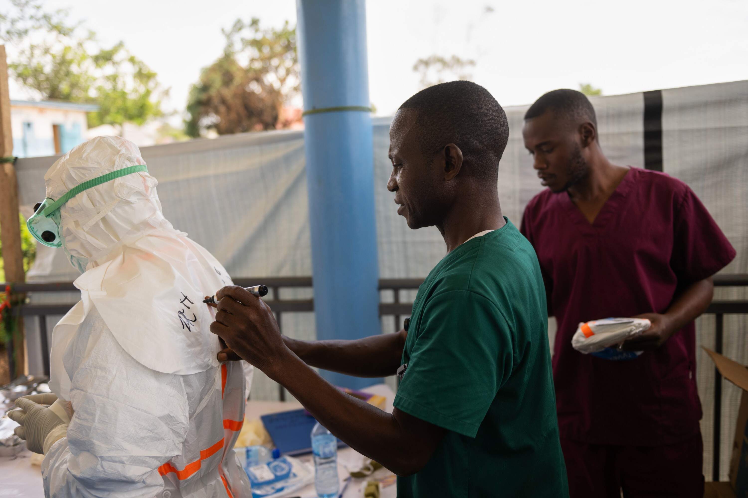 Health workers prepare for duty at the Ebola treatment center in Rwampara in the Ituri Province of the eastern Democratic Republic of the Congo (DRC) on May 29. (Moses Sawasawa/ AP)