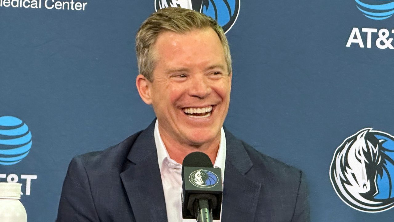 Dallas Mavericks coach Dusty May smiles while responding to a question during his introductory NBA basketball news conference in Dallas, Monday, June 29, 2026. (AP Photo/Schuyler Dixon)