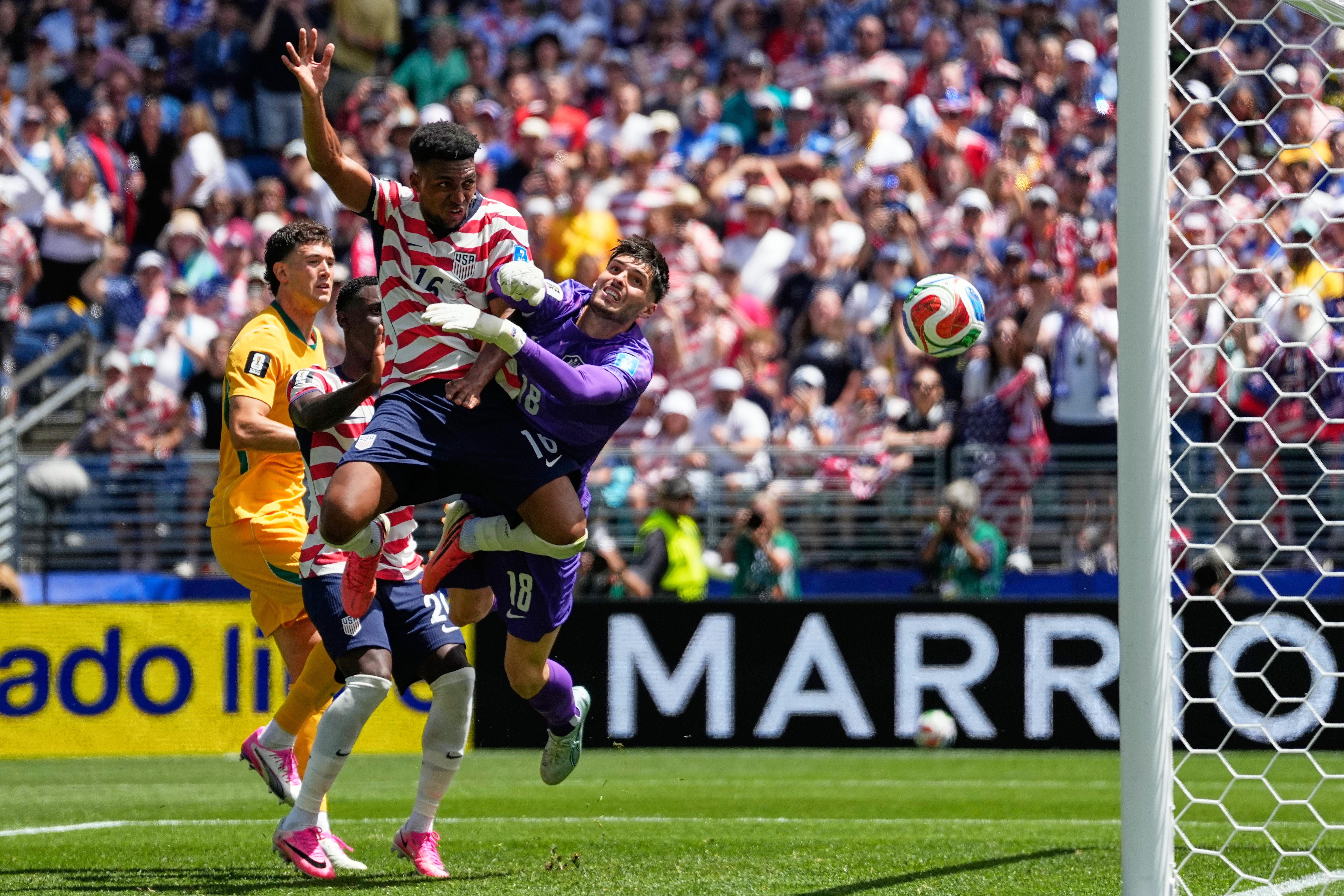 United States’ Alex Freeman, center, scores his side’s second goal...