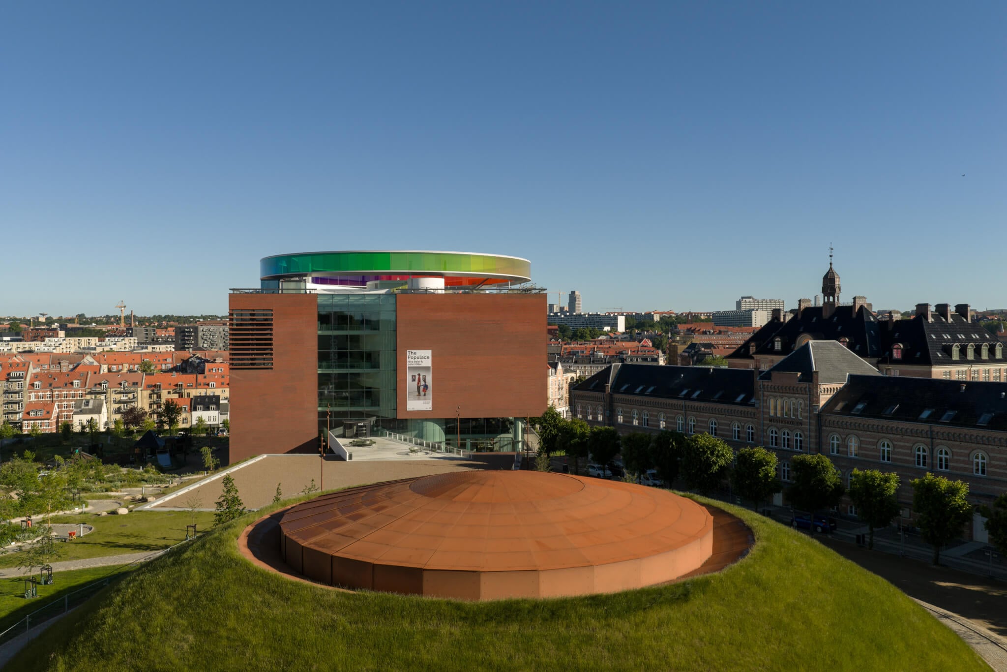 a roof pokes out atop grassy mound